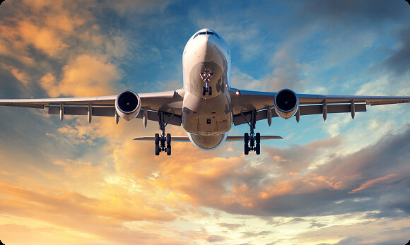 Commercial airliner on approach at sunset