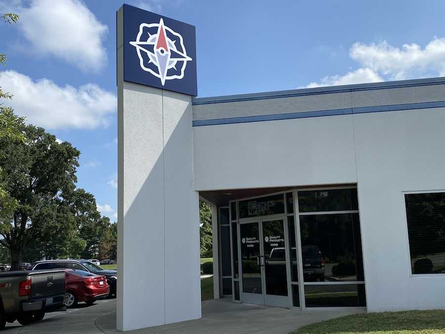 Quality Products & Machine building with the Compass Precision sign